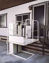 Mac's PL-50 wheelchair elevator lift carrying a rider with a 750 lb capacity platform in Las Vegas - ELECTROPEDIC