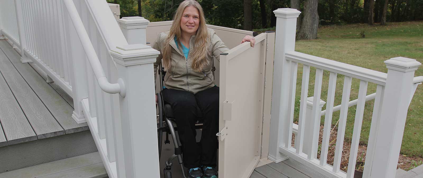Wheelchair porch lift with under-platform safety pan and tall safety guardrails in Las Vegas - ELECTROPEDIC